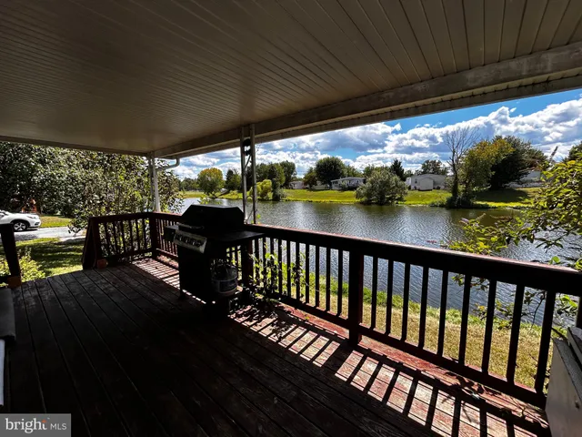 a view of a chairs and table in patio