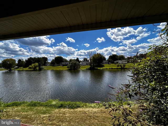 a view of a lake in between of a house