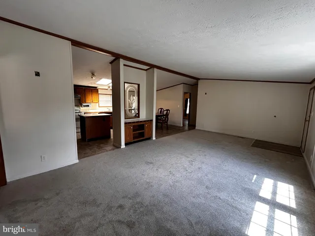 a view of a livingroom with furniture and a flat screen tv