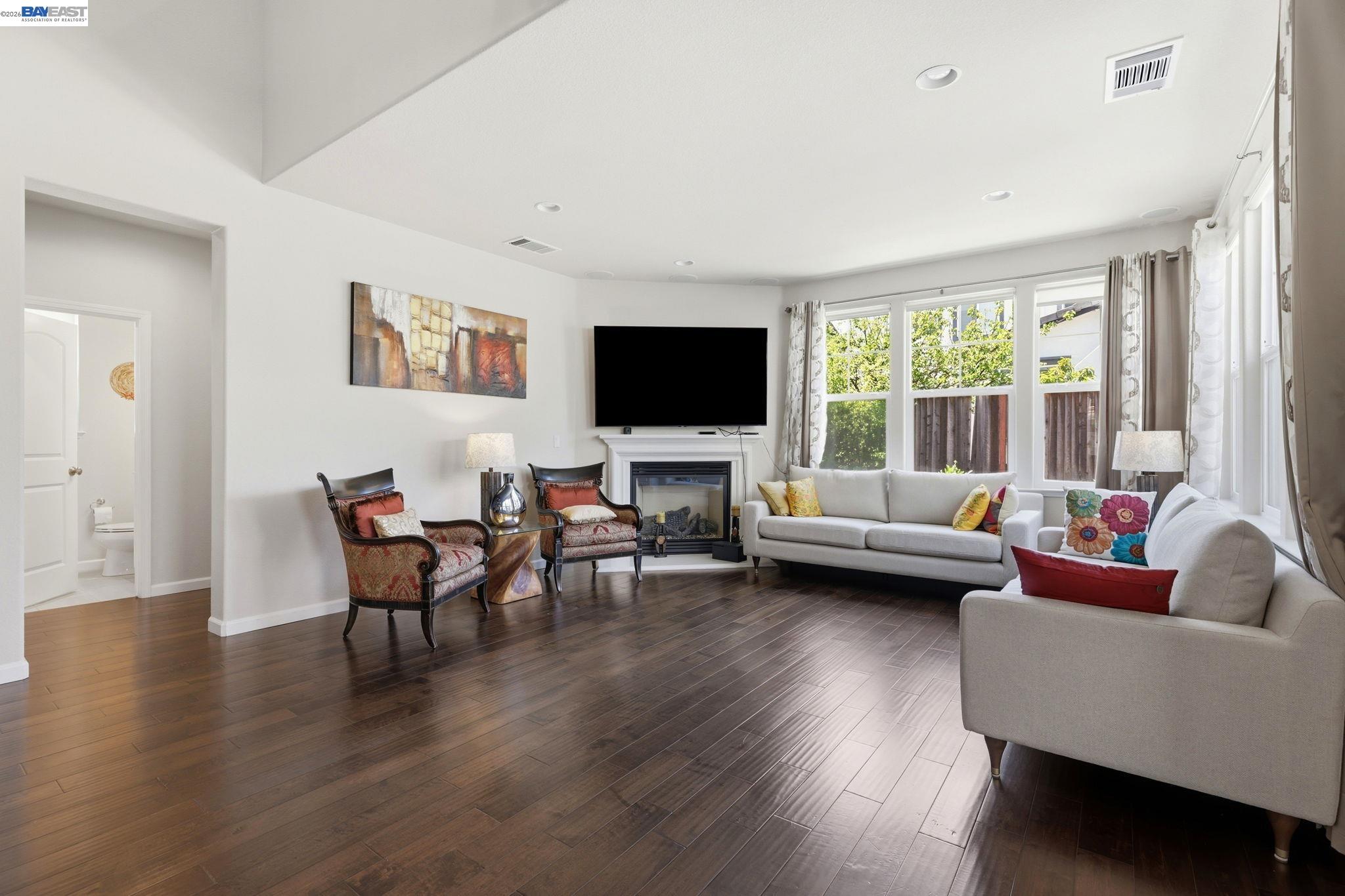 5029 Queensbury Way San Ramon, CA 94582 - Photo 6 of 58 a living room with furniture and a flat screen tv