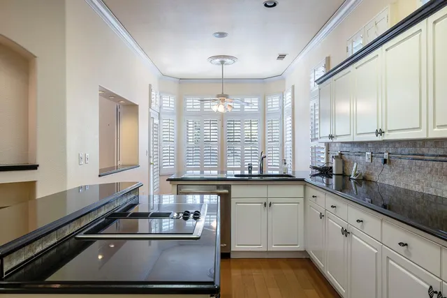 a kitchen with a stove and a sink