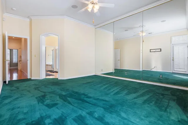 a en suite bathroom with a sink and a large mirror