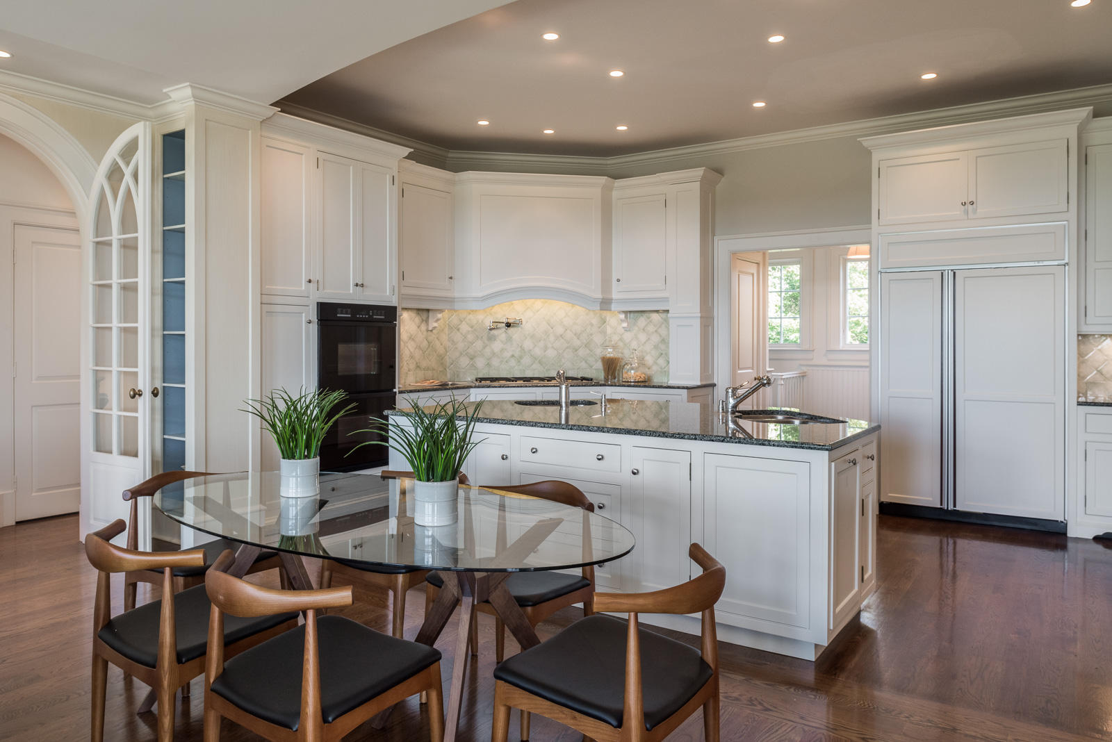 84 Turtle Back Road New Canaan, CT 06840 - Photo 12 of 35 a kitchen with white cabinets and counter space