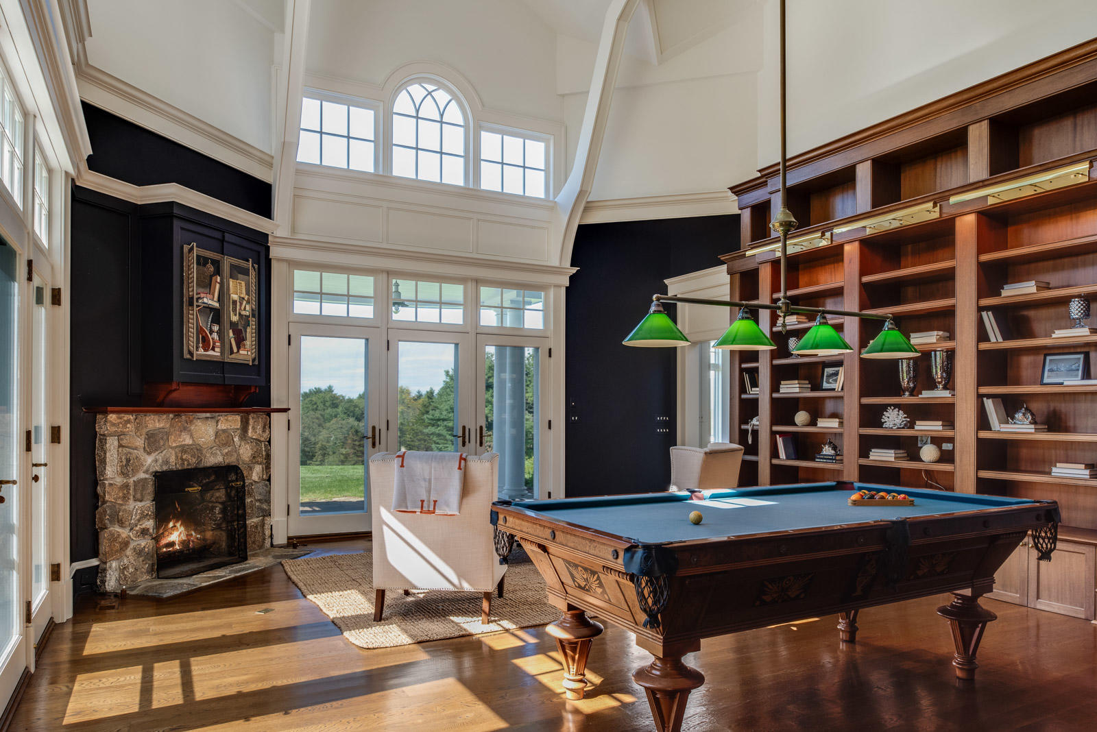 84 Turtle Back Road New Canaan, CT 06840 - Photo 14 of 35 a living room with a large piano table and a fireplace