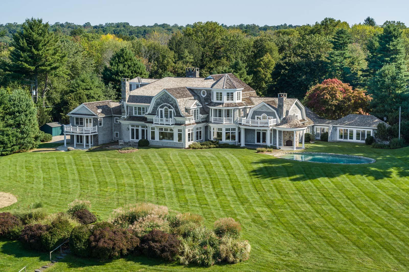84 Turtle Back Road New Canaan, CT 06840 - Photo 25 of 35 a view of house with garden and tall trees