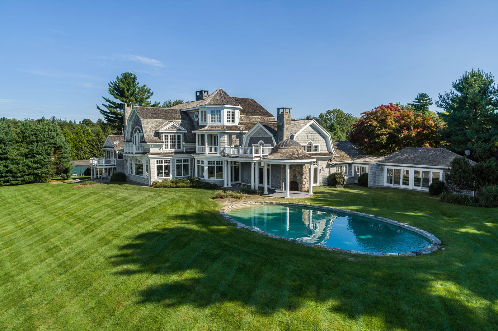 84 Turtle Back Road New Canaan, CT 06840 - Photo 26 of 35 a front view of house with yard and swimming pool