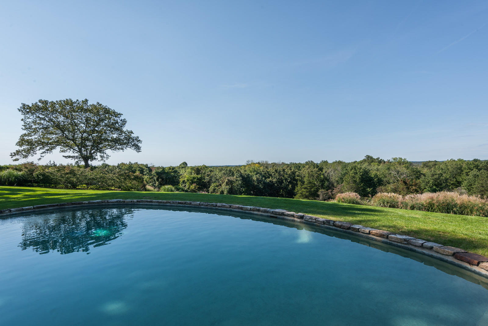 84 Turtle Back Road New Canaan, CT 06840 - Photo 28 of 35 a view of a lake with a yard