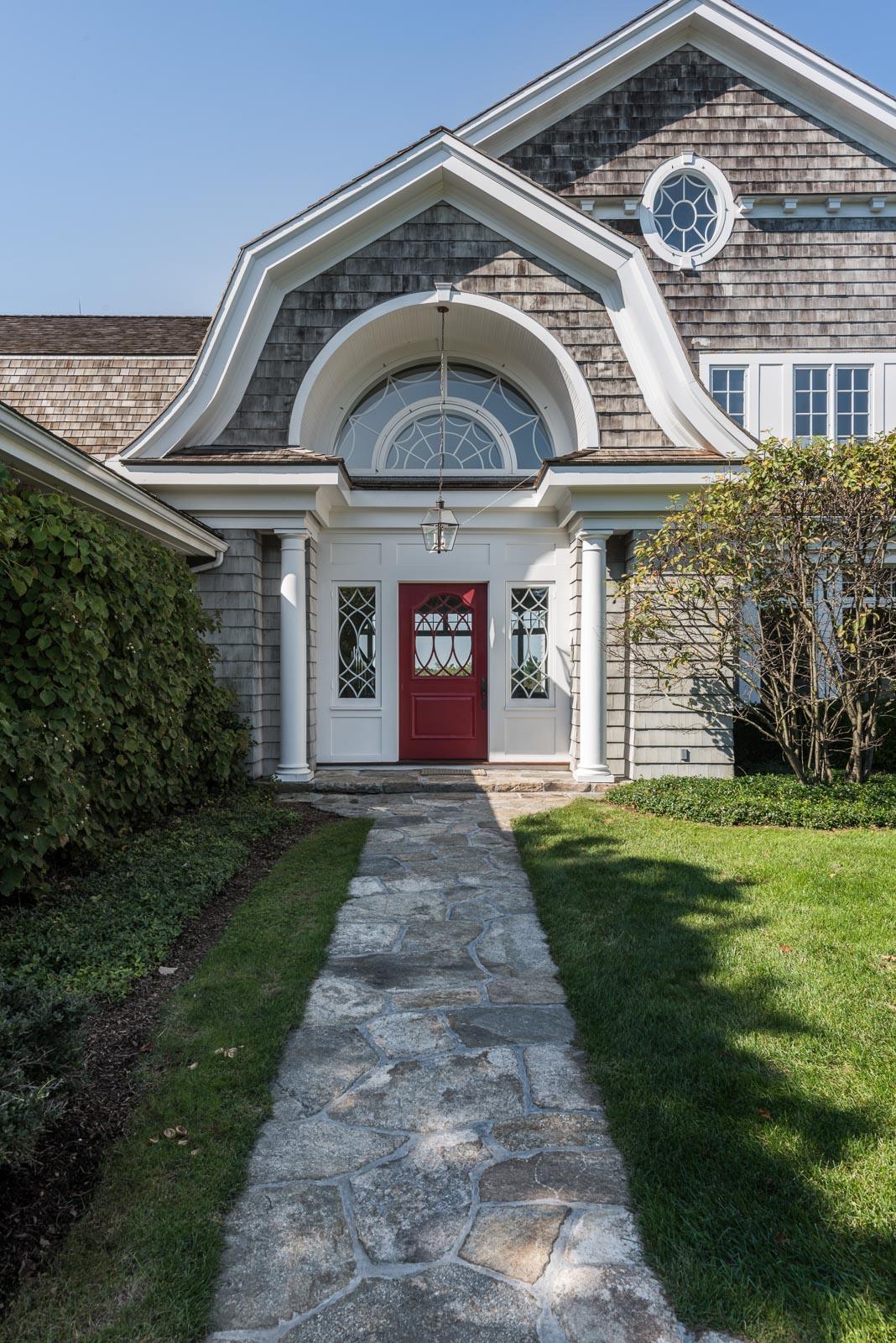 84 Turtle Back Road New Canaan, CT 06840 - Photo 3 of 35 a front view of a house with garden