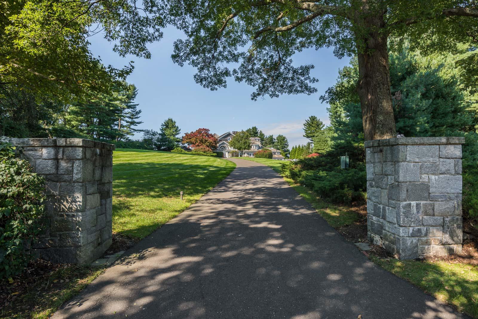 84 Turtle Back Road New Canaan, CT 06840 - Photo 32 of 35 a view of a garden with a tree