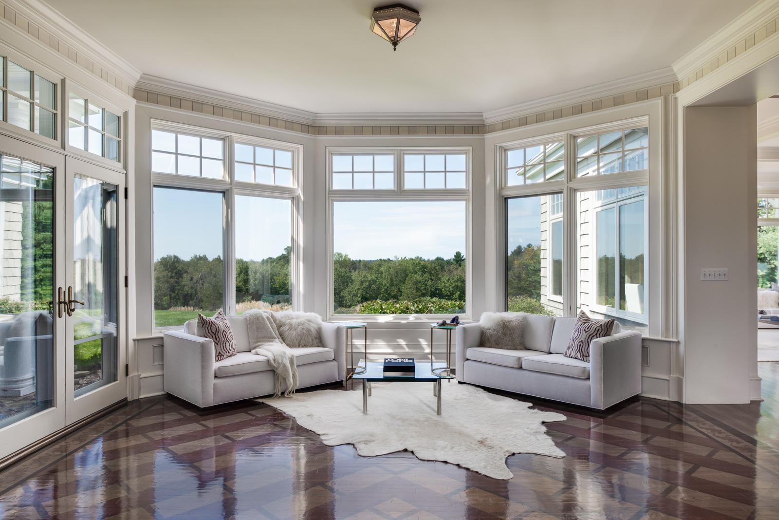 84 Turtle Back Road New Canaan, CT 06840 - Photo 6 of 35 a living room with furniture and large windows