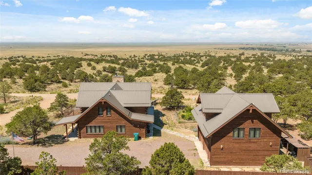 an aerial view of residential houses with city view