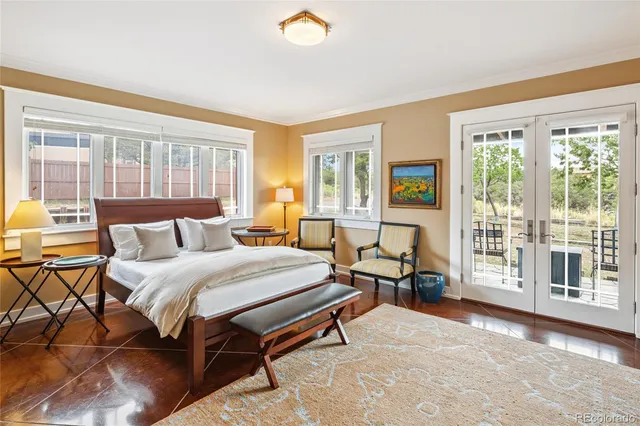 a spacious bedroom with a bed and a large window