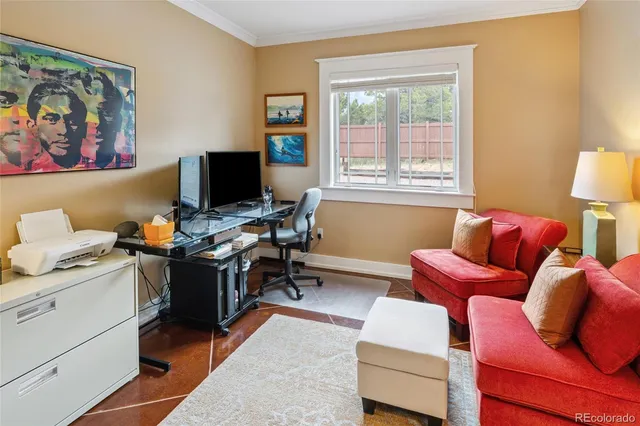 a reading room with furniture and a window