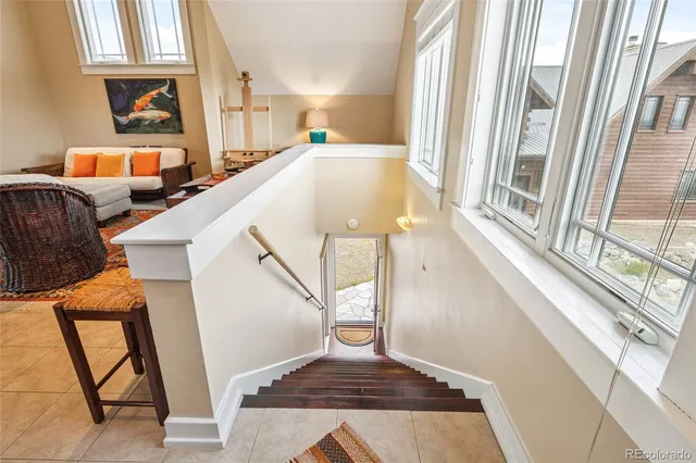 a living room with furniture and a rug