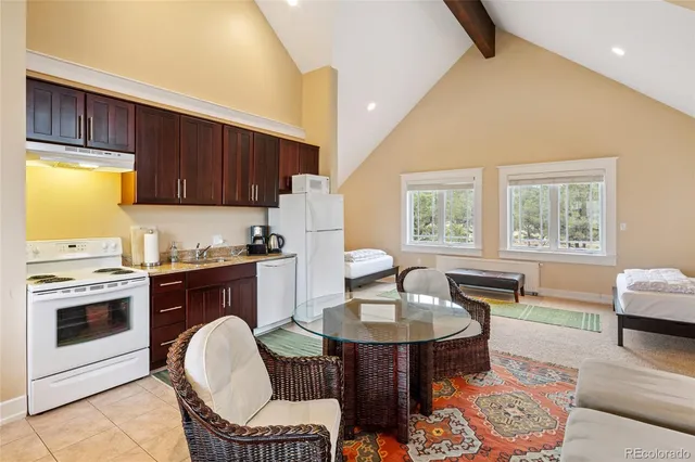 a bedroom with a bed and flat screen tv