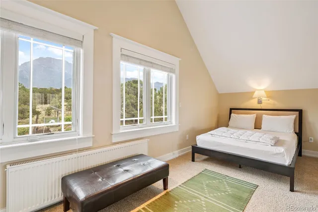 a living room with a couch and next to a window