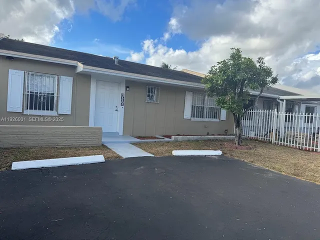 a view of a house with a garage