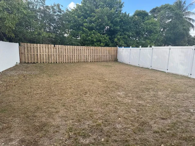 a view of backyard and yard