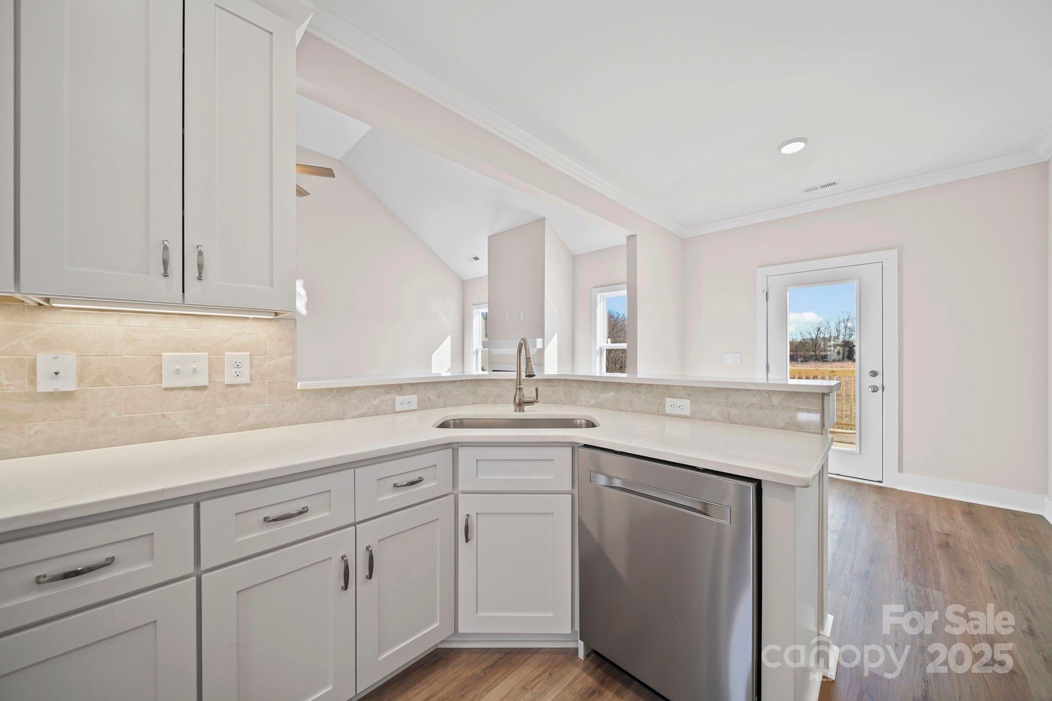 4106 New Salem Road Marshville, NC 28103 - Photo 20 of 46 a kitchen with white cabinets and sink