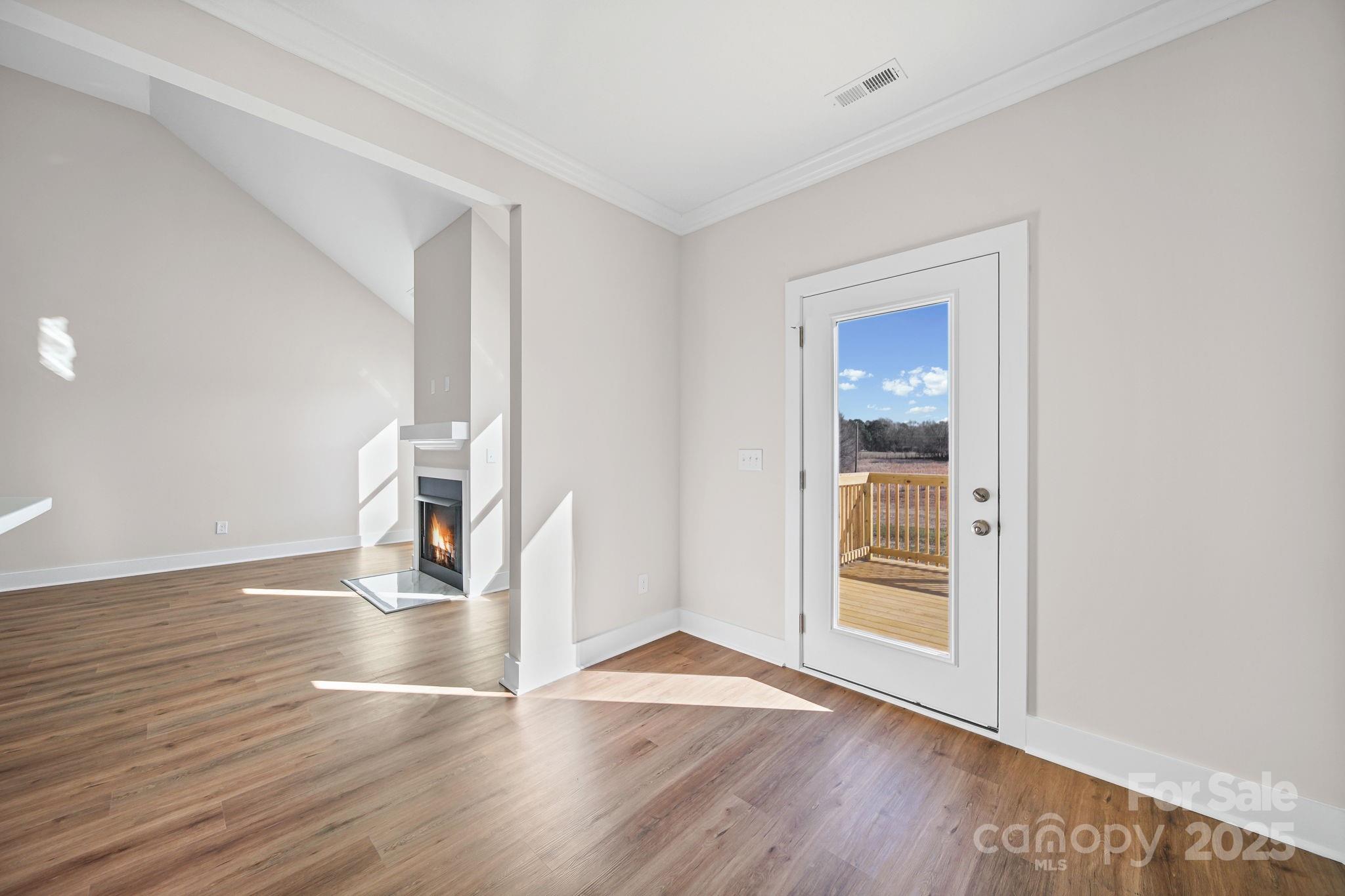 4106 New Salem Road Marshville, NC 28103 - Photo 21 of 46 wooden floor in an empty room with a window