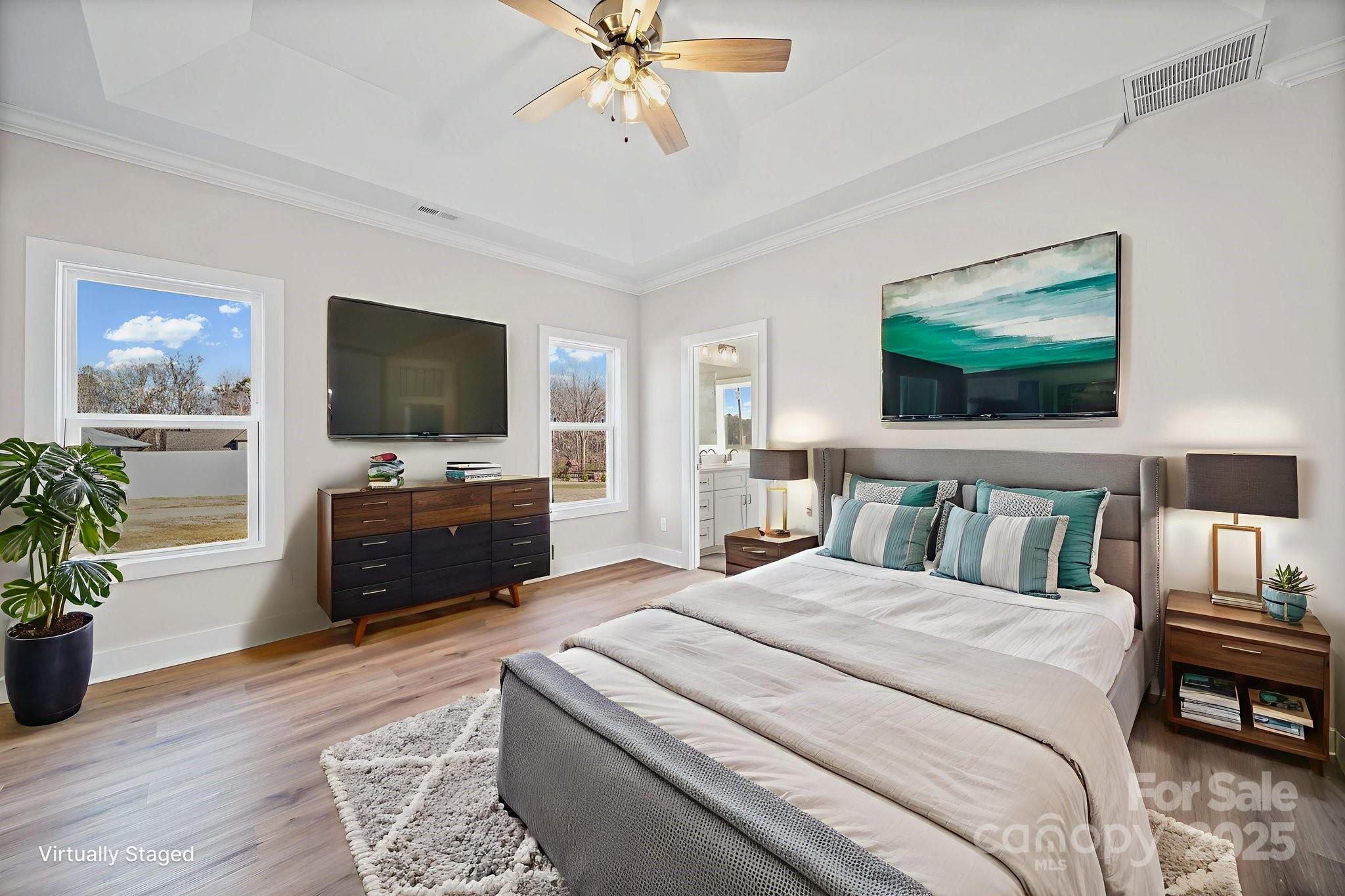 4106 New Salem Road Marshville, NC 28103 - Photo 23 of 46 a spacious bedroom with a bed and a flat screen tv