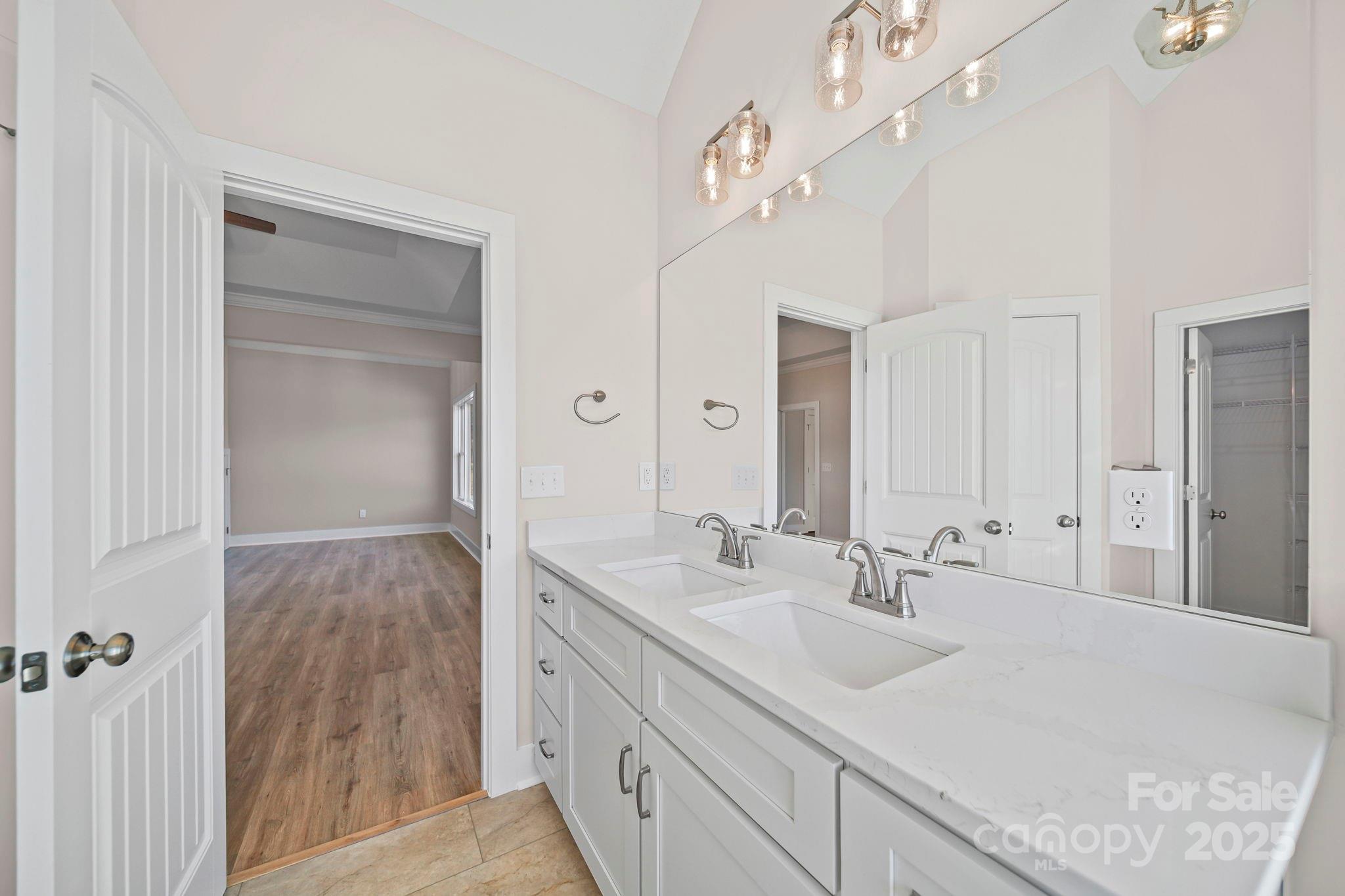 4106 New Salem Road Marshville, NC 28103 - Photo 31 of 46 a bathroom with a sink double vanity and a mirror