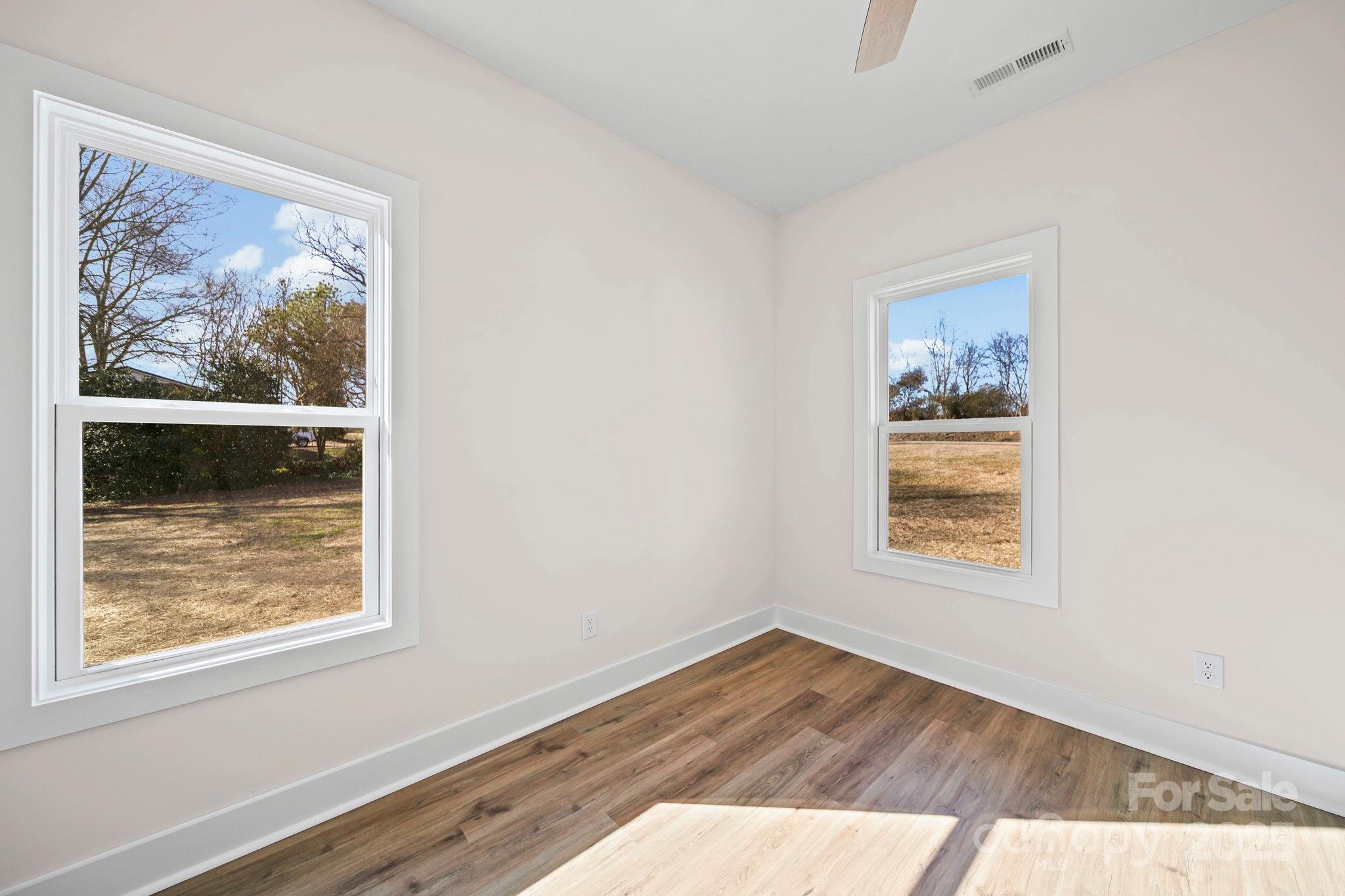 4106 New Salem Road Marshville, NC 28103 - Photo 34 of 46 an empty room with wooden floor and window
