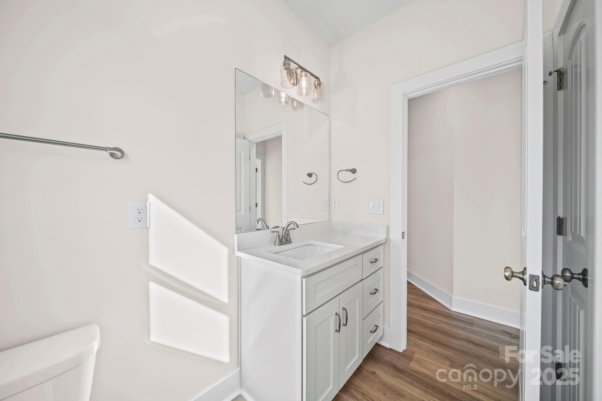 4106 New Salem Road Marshville, NC 28103 - Photo 39 of 46 a bathroom with a sink a mirror and a shower