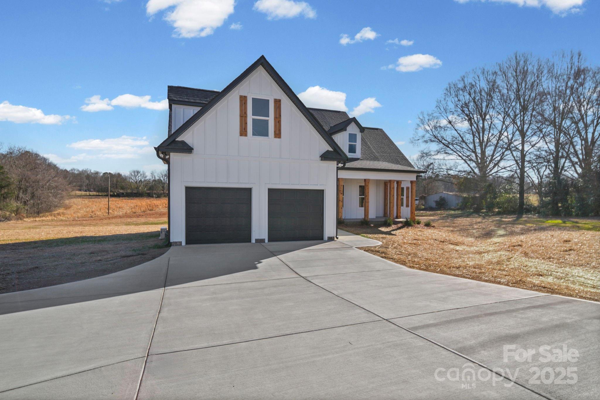 4106 New Salem Road Marshville, NC 28103 - Photo 4 of 46 a front view of house with yard and trees in the background