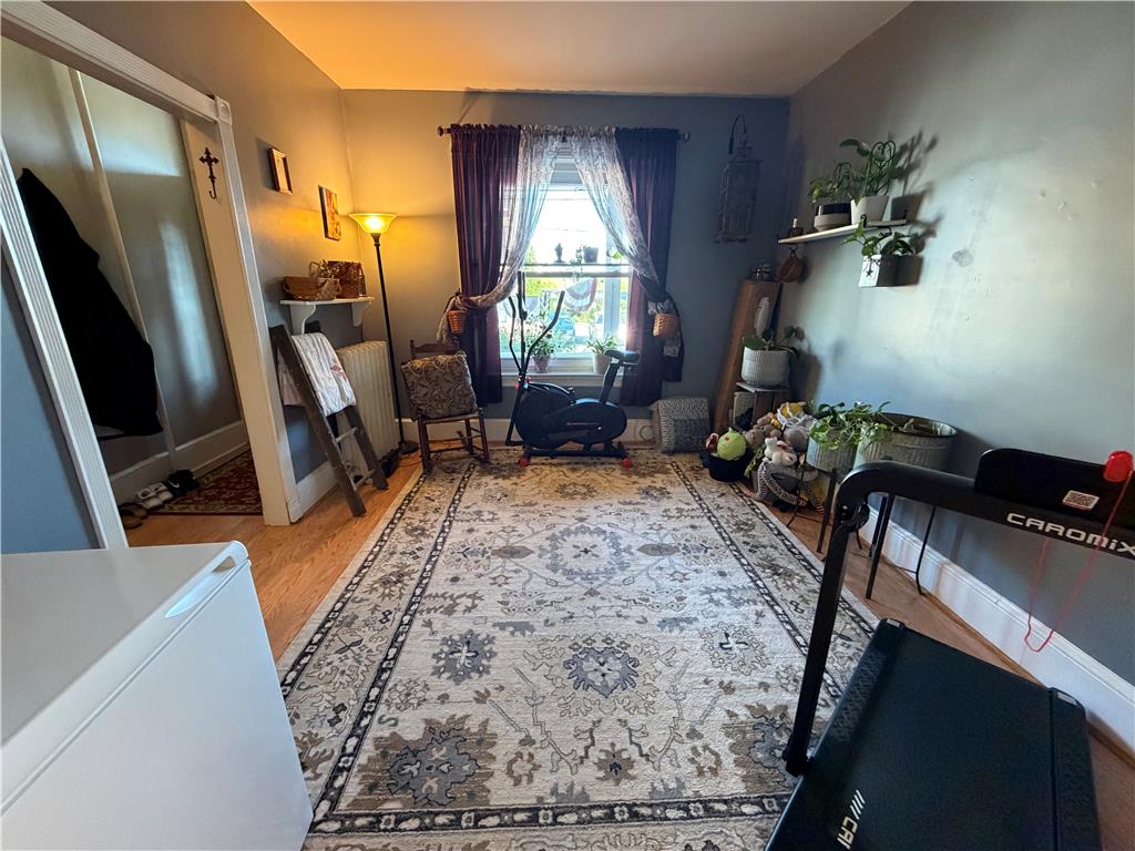 27 South Chestnut Street Boyertown, PA 19512 - Photo 9 of 17 Natural light filters into a room featuring hardwood floors, an area rug, and ample wall space.