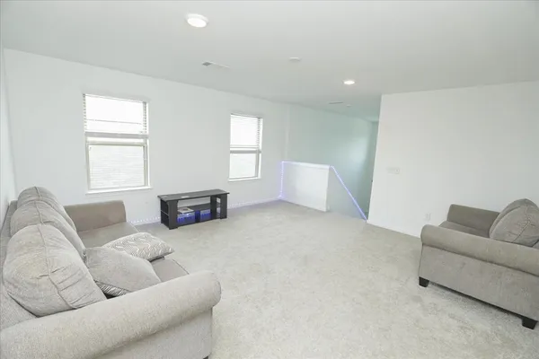 a living room with furniture and a couch