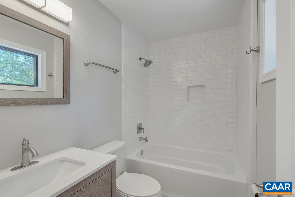 26 Dogleg Road Palmyra, VA 22963 - Photo 15 of 48 a bathroom with a sink toilet and shower