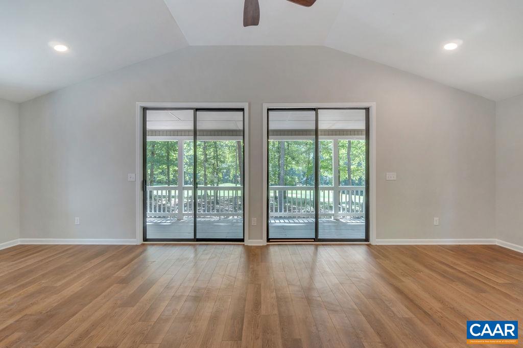 26 Dogleg Road Palmyra, VA 22963 - Photo 22 of 48 a view of an empty room with wooden floor and a window