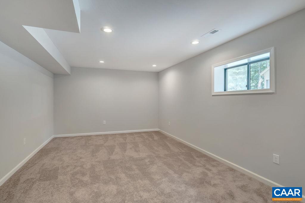26 Dogleg Road Palmyra, VA 22963 - Photo 27 of 48 an empty room with a ceiling fan