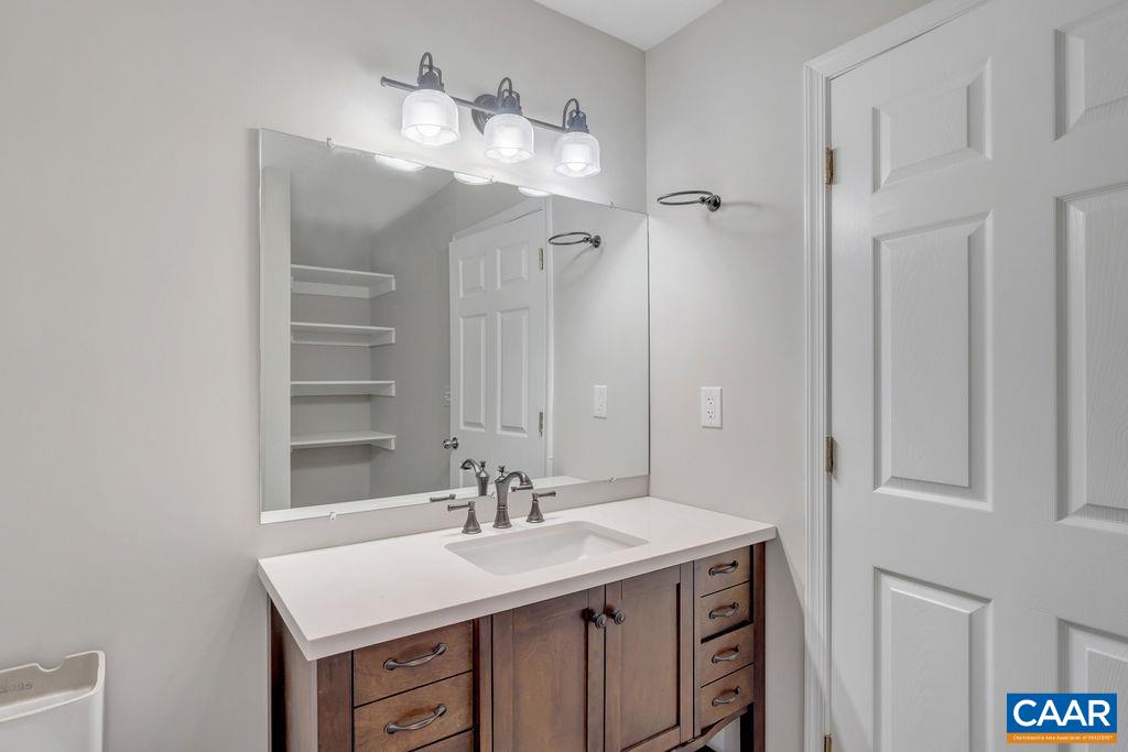 26 Dogleg Road Palmyra, VA 22963 - Photo 31 of 48 a bathroom with a sink vanity and a mirror