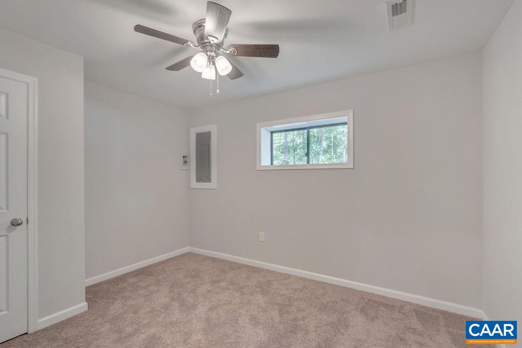 26 Dogleg Road Palmyra, VA 22963 - Photo 33 of 48 an empty room with windows and fan