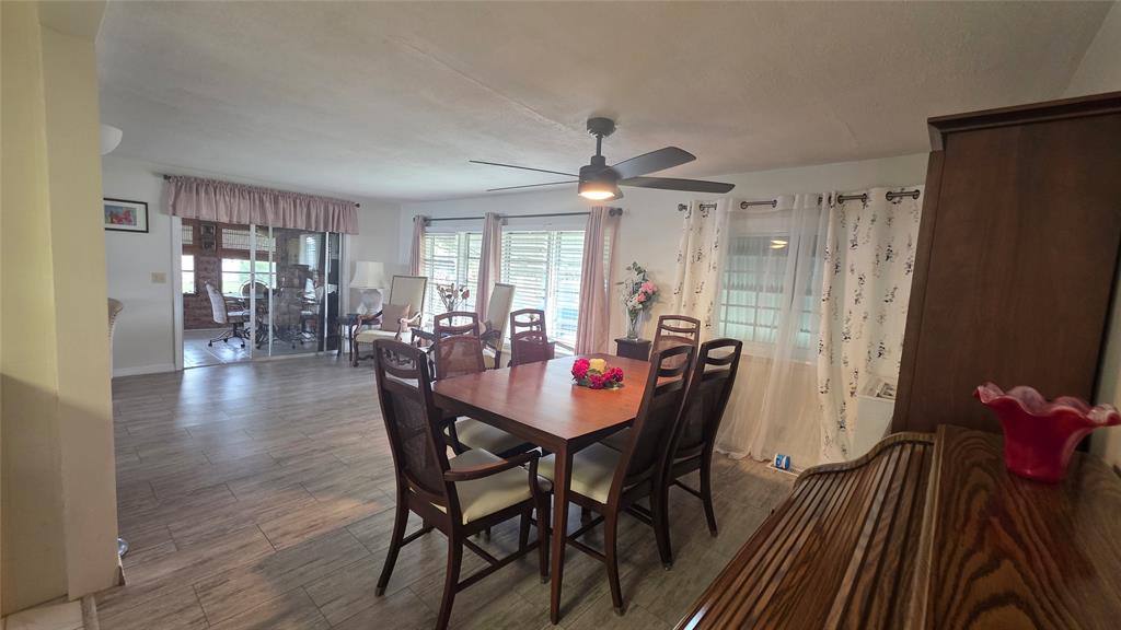 1931 Southwest 85th Avenue Davie, FL 33324 - Photo 12 of 35 a view of a dining room with furniture window and wooden floor