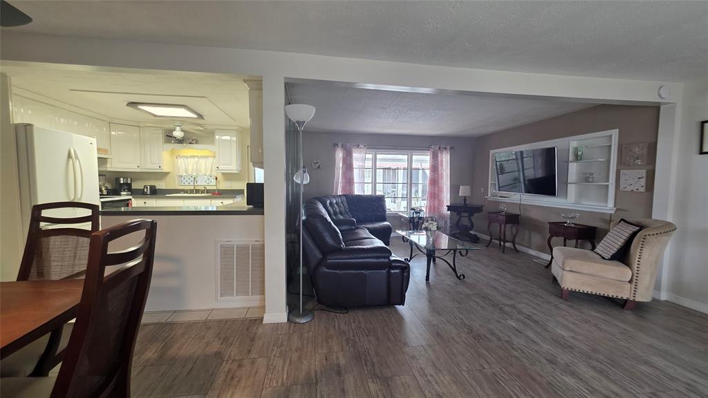 1931 Southwest 85th Avenue Davie, FL 33324 - Photo 14 of 35 a living room with furniture and a wooden floor