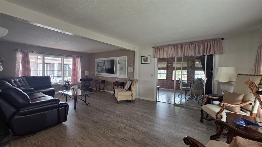 1931 Southwest 85th Avenue Davie, FL 33324 - Photo 15 of 35 a living room with furniture and wooden floor