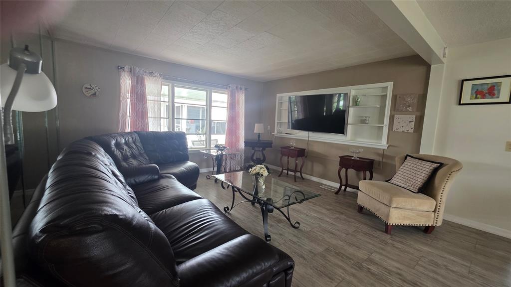 1931 Southwest 85th Avenue Davie, FL 33324 - Photo 17 of 35 a living room with furniture and a flat screen tv