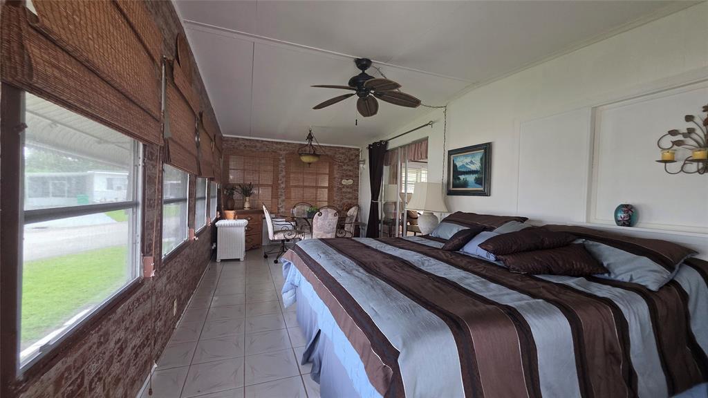 1931 Southwest 85th Avenue Davie, FL 33324 - Photo 22 of 35 a bedroom with double bed and a large window