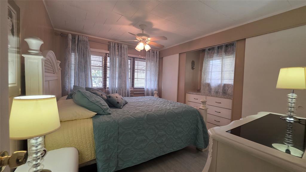 1931 Southwest 85th Avenue Davie, FL 33324 - Photo 33 of 35 a bedroom with a bed and dresser with mirror