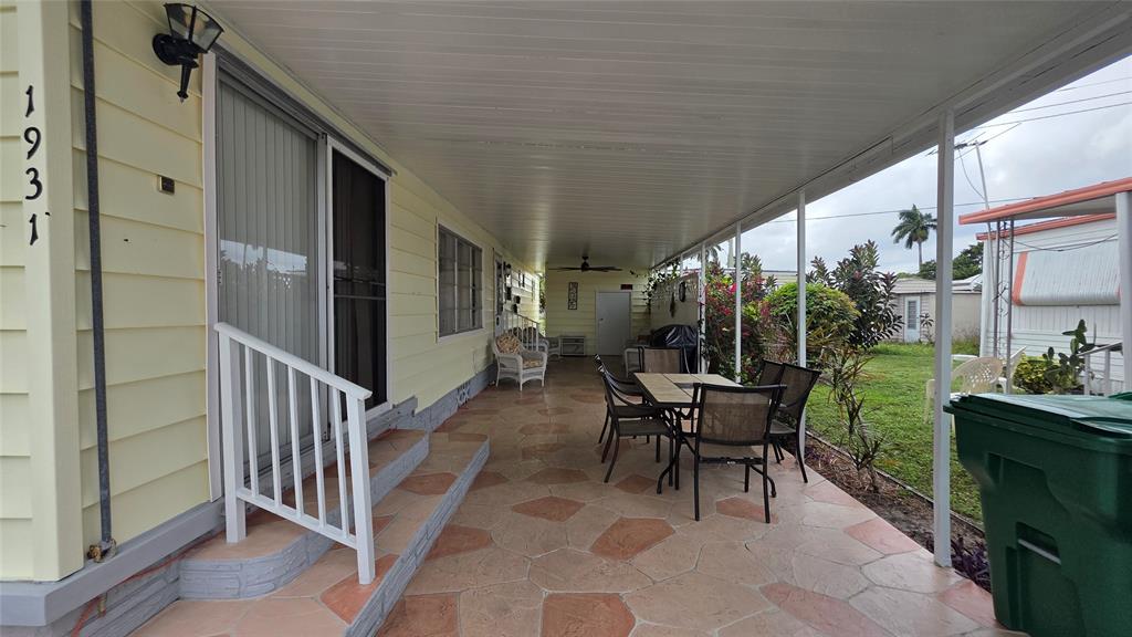 1931 Southwest 85th Avenue Davie, FL 33324 - Photo 4 of 35 a balcony with chairs and with potted plants