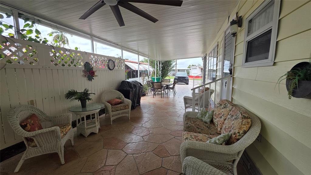 1931 Southwest 85th Avenue Davie, FL 33324 - Photo 7 of 35 a view of a chairs and table in a patio