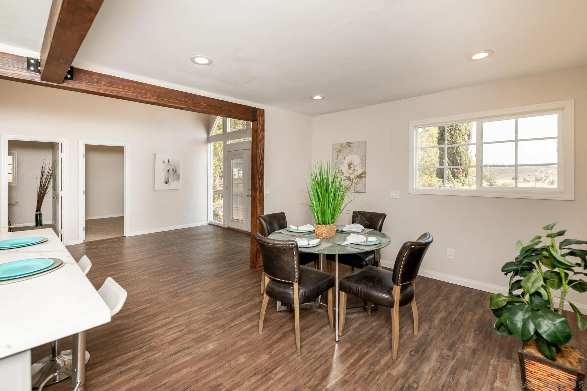 25511 Potrero Valley Road Potrero, CA 91963 - Photo 11 of 48 a view of a dining room with furniture and wooden floor