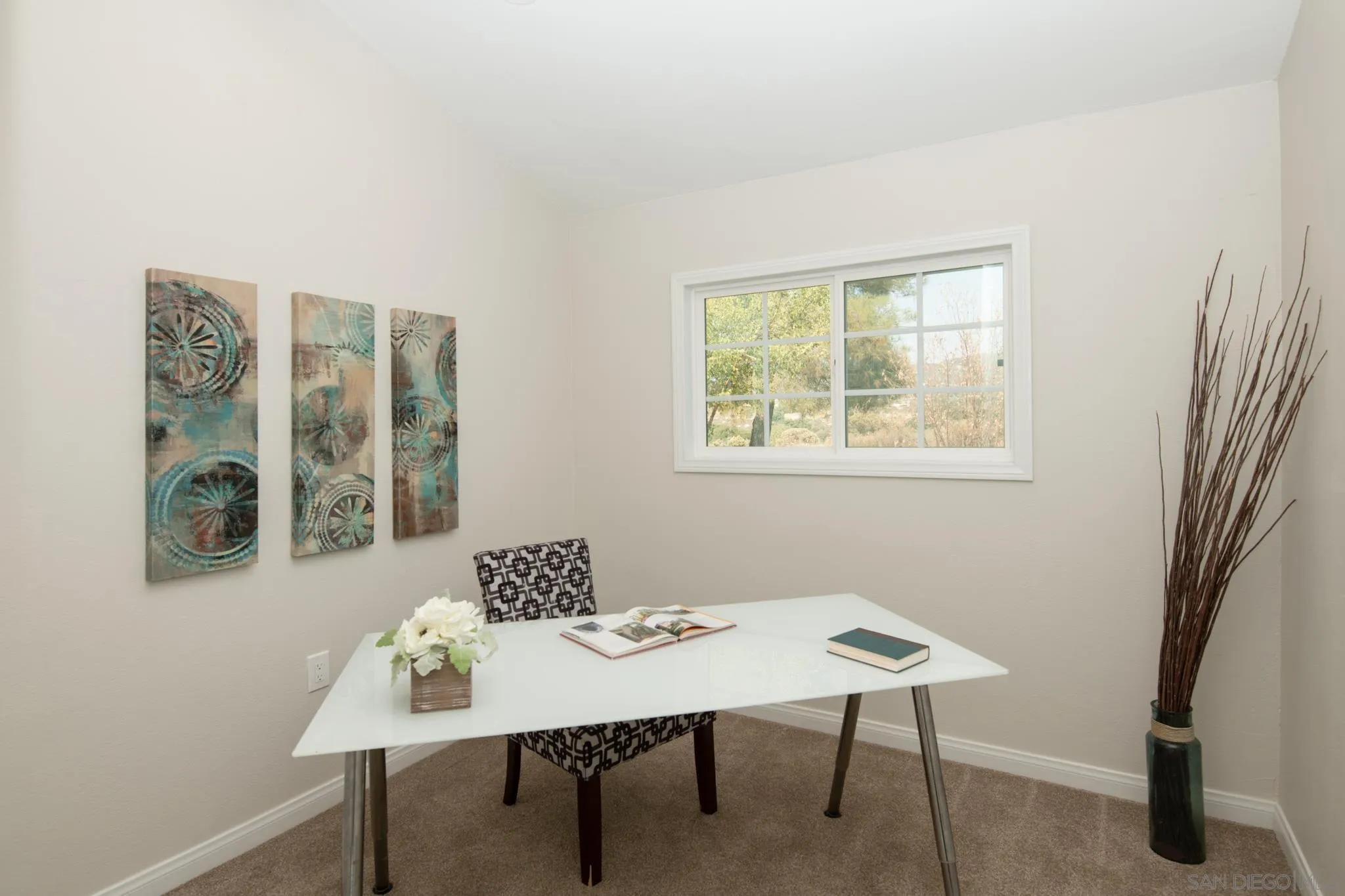 25511 Potrero Valley Road Potrero, CA 91963 - Photo 15 of 48 a view of a workspace with furniture and a window