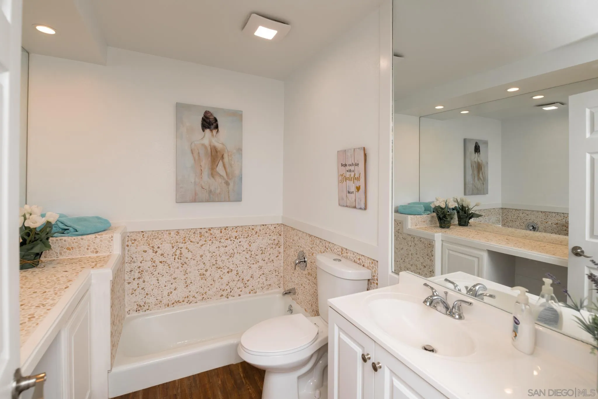 25511 Potrero Valley Road Potrero, CA 91963 - Photo 18 of 48 a bathroom with a bathtub shower sink vanity mirror and toilet