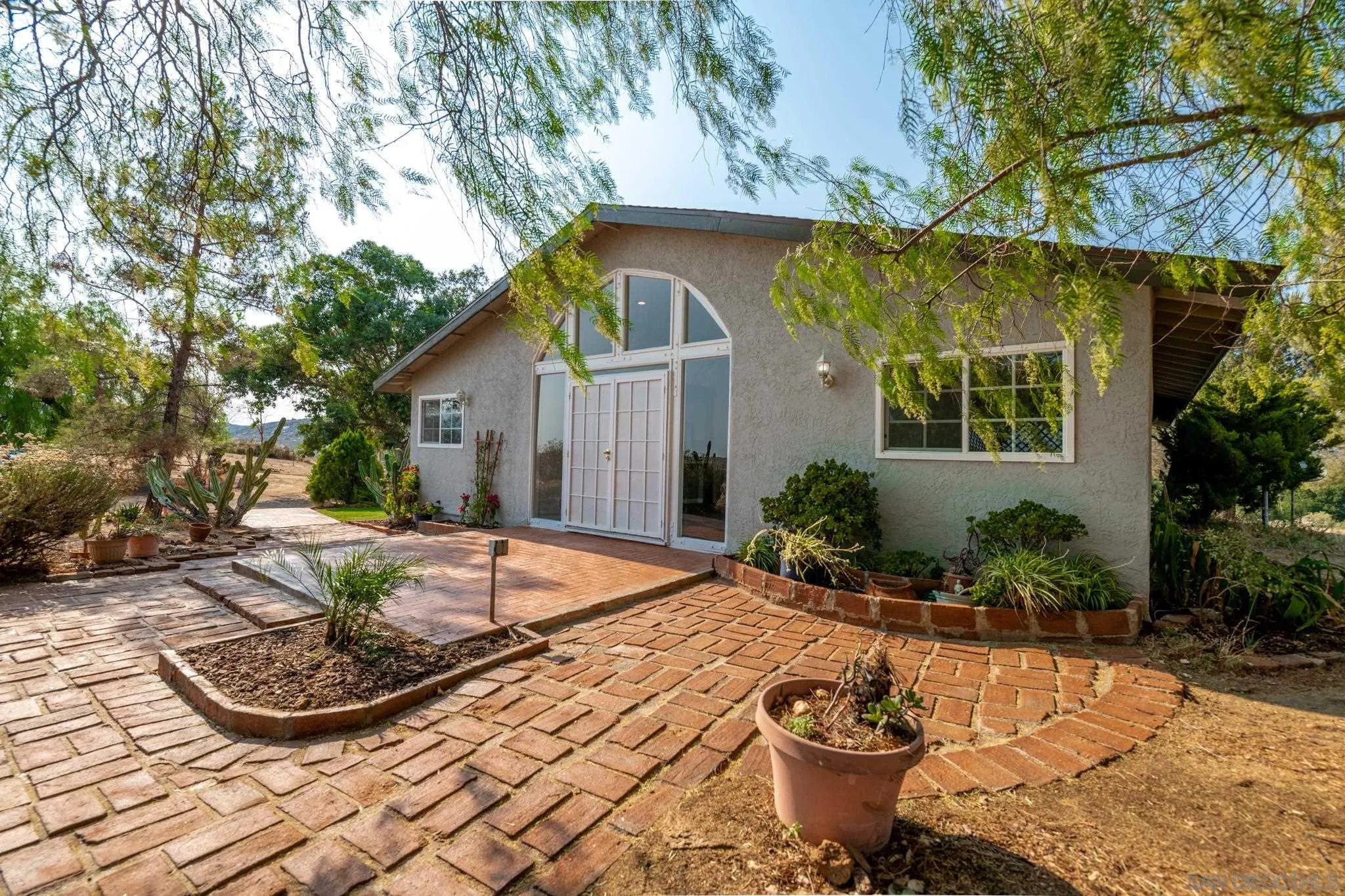25511 Potrero Valley Road Potrero, CA 91963 - Photo 2 of 48 a view of a backyard with plants and patio