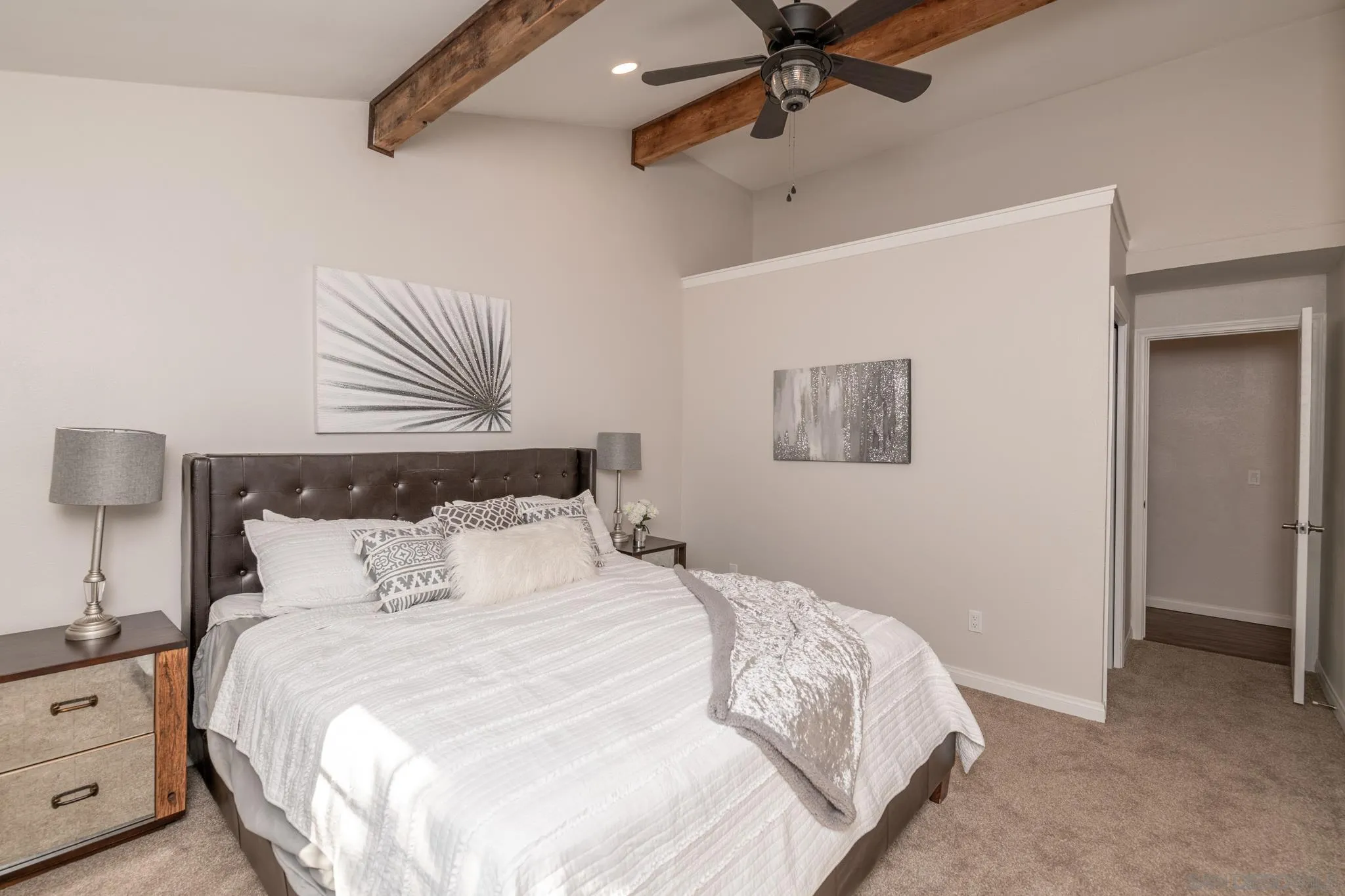 25511 Potrero Valley Road Potrero, CA 91963 - Photo 23 of 48 a bedroom with a bed and a painting on the wall