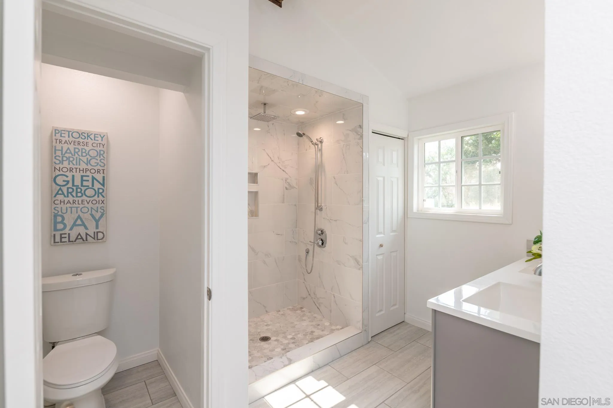 25511 Potrero Valley Road Potrero, CA 91963 - Photo 27 of 48 a bathroom with a granite countertop sink a toilet and shower